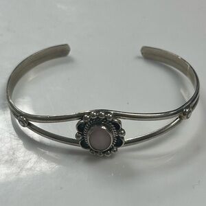 Sterling Silver and Pink Mother of Pearl oval center stone.